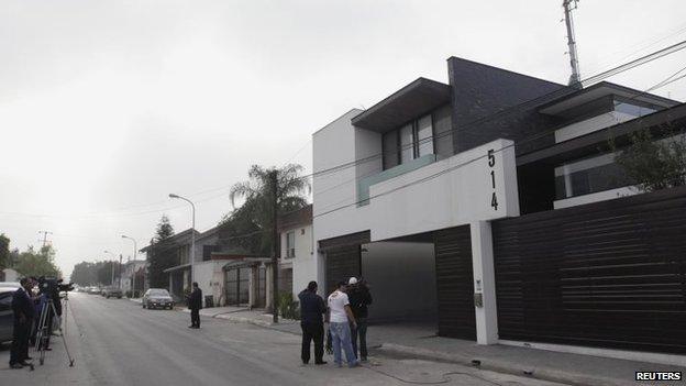 Journalists stand outside the house where Omar Trevino, leader of the Zetas drug cartel, was detained by federal forces in San Pedro Garza, near Monterrey on 4 March, 2015.