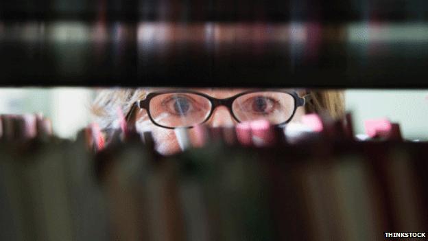 Woman looking at gap in paperwork