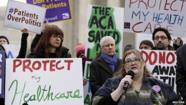 Laura Hayes (with microphone), of Fort Wayne, Indiana tells fellow protestors how the Affordable Care Act helped her with health costs, during a protest in front of the Supreme Court in Washington4 March2015