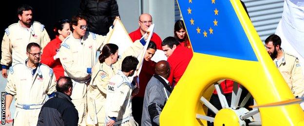 Fernando Alonso is transported to the medical helicopter