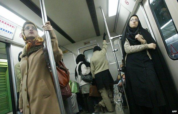 Women standing on metro