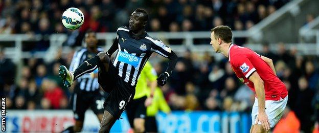 Papiss Cisse and Jonny Evans