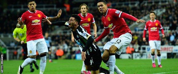 Emmanuel Riviere goes down under Chris Smalling's challenge