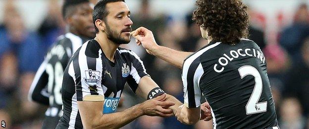 Jonas Gutierrez is given the captain's armband by Fabricio Coloccini