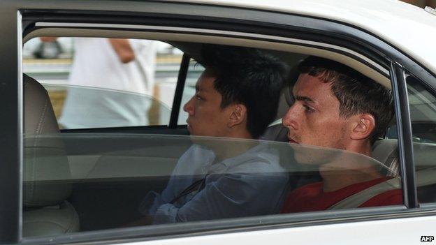 Andreas Von Knorre, one of the two German nationals arrested in Singapore for vandalism, arrives in a police car to the state court on 22 November 2014