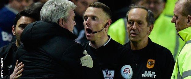 Steve Bruce restrained by assistant referee