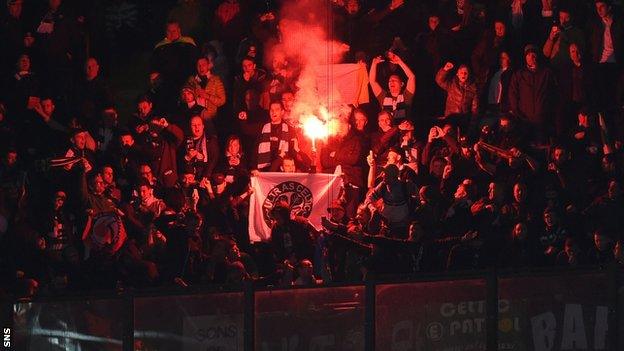 A flare is set off during Celtic's match against Inter Milan