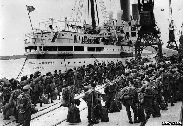 Members of the 55 Independent Squadron wait to board the Empire Windrush at Southampton, to fight in the Korean War