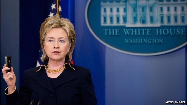 US Secretary of State Hillary Clinton holds up a cell phone as she announces release of 100 million dollars in emergency aid to help displaced civilians in Pakistan in the Brady Briefing Room of the White House in Washington, DC, 19 May 2009.