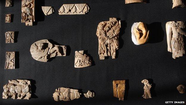 Some of a collection of 6,000 pieces of carved ivory known as the Nimrud Ivories discovered in the city of Nimrud in modern day Iraq but acquired by the British Museum are displayed in 2011 in London, the UK