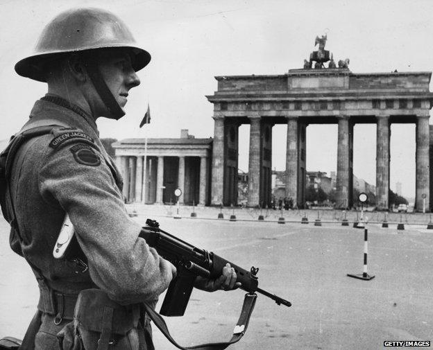 1961: A British soldier on patrol by the Brandenburg gate in Berlin