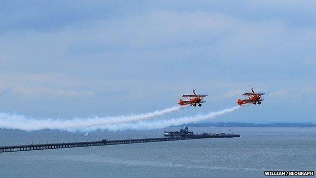 Two biplanes at the Southend Airshow with wingwalkers