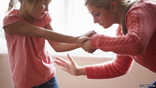 Mother hitting daughter