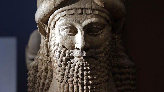 Detail of a statue from the Assyrian period displayed at the Iraqi National Museum in Baghdad