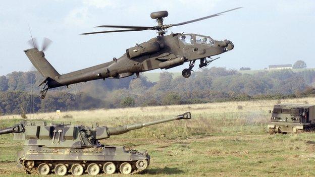 A UK Apache attack helicopter taking part in a training exercise on Salisbury Plain