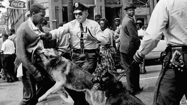 Dog attacks civil rights demonstrator in Birmingham Alabama in 1963