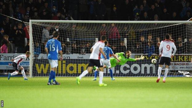 Falkirk's Craig Sibbald (left) gets his head onto the end of a ball to give his side the lead