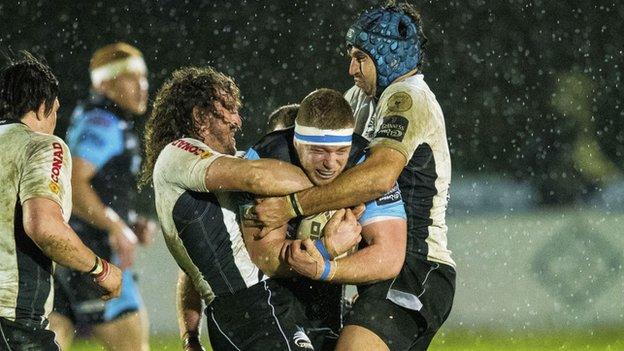 Glasgow Warriors' Alex Allan (centre) is tackled by Ruben Riccioli (right) and Mauro Bergamasco