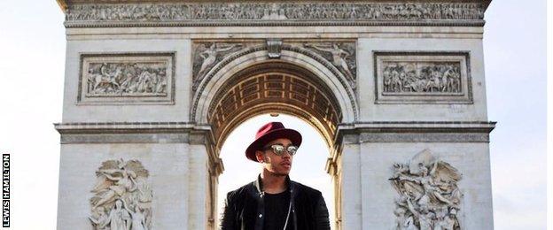 Lewis Hamilton stood in front of the Arc De Triomphe