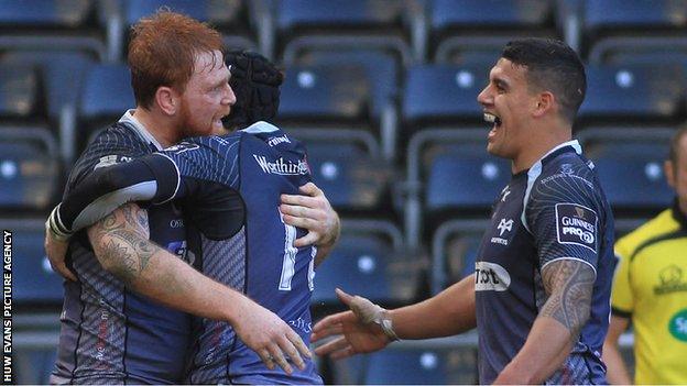 Dan Baker celebrates his try for Ospreys