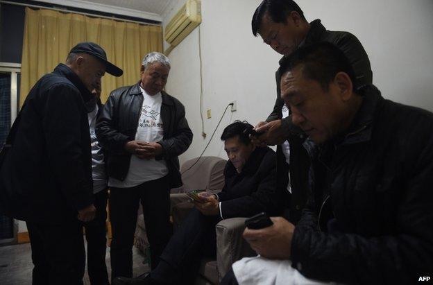 Relatives of people missing on Flight MH370 gather in in Shunyi, on the outskirts of Beijing, 7 March