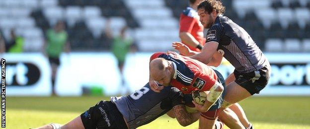 BJ Botha is tackled by the Ospreys