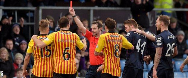 Kallum Higginbotham is sent off by referee Alan Muir