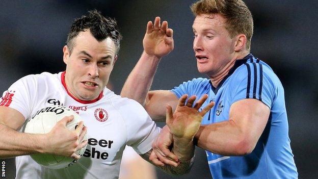 Cathal McCarron of Tyrone is challenged by Dublin's Ciaran Kilkenny