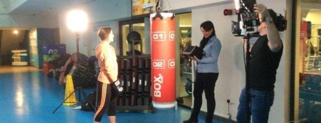 Suzi Perry getting ready to kick box on the set of the shoot