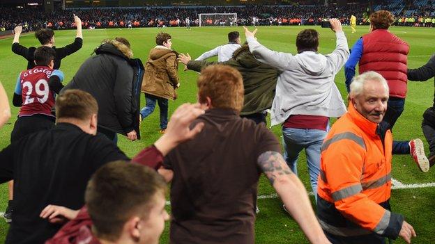 Fans on the Villa Park pitch after Aston Villa's FA Cup quarter-final win over West Brom