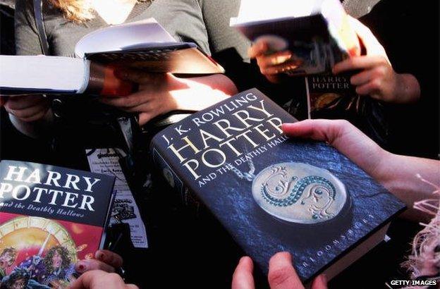 People holding Harry Potter books