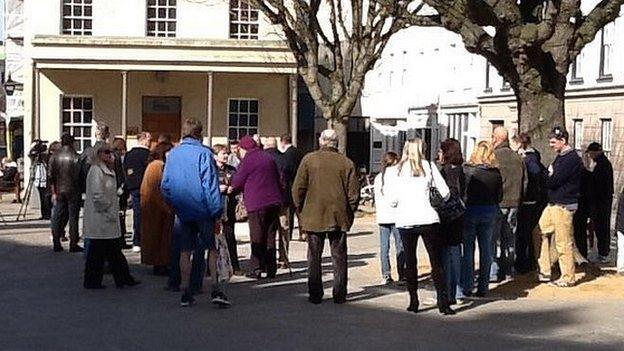 People gathering in the Royal Square