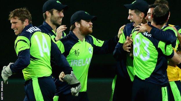 Gary Wilson (left) joins the Irish celebrations after the win over Zimbabwe