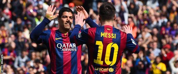 Luis Suarez and Lionel Messi celebrate