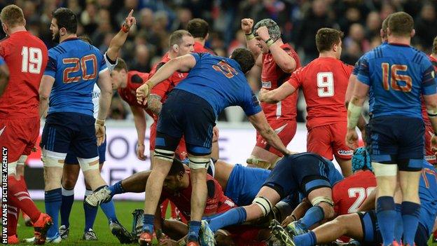 The Wales players celebrate after beating France in Paris