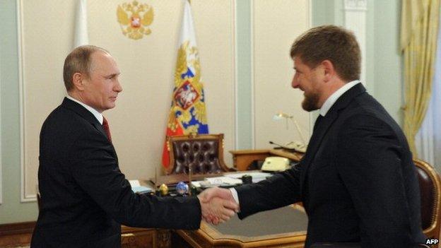 Russia's President Vladimir Putin (L) shakes hands with Chechnya's head Ramzan Kadyrov during their meeting in the Novo-Ogaryovo residence outside Moscow, on April 7, 2014.