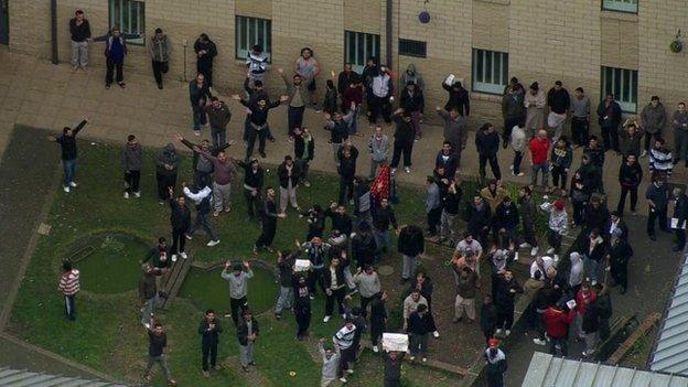 Detainees at Harmondsworth Detention Centre protesting in the exercise yard