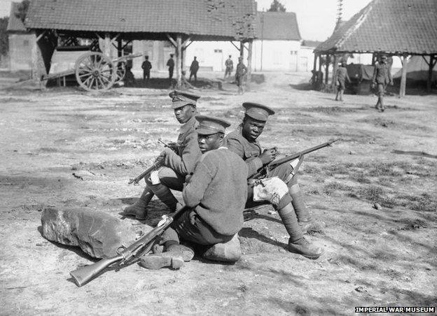 Troops of the West Indies Regiment cleaning their rifles on the Albert - Amiens road, September 1916.