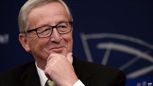 Jean-Claude Juncker gestures during a press conference on October 22, 2014