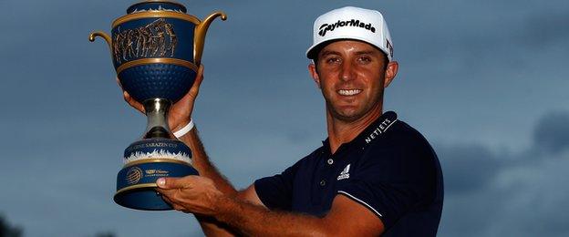 Dustin Johnson with the WGC Championship trophy