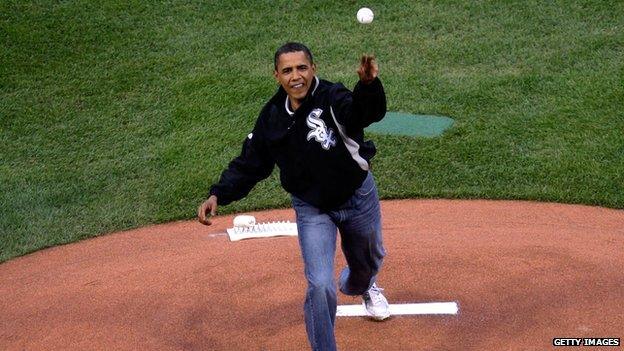 President Obama throws out the first pitch at a baseball game in 2009.