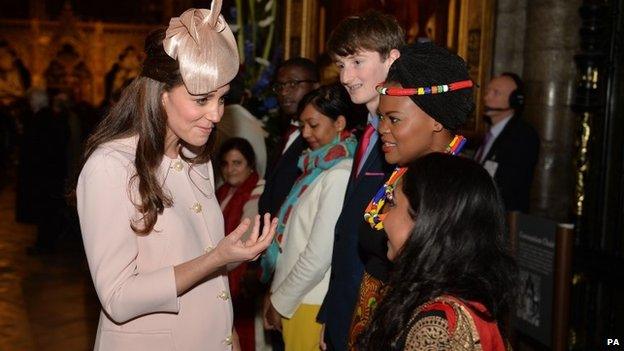 The Duchess of Cambridge talks to guests as she leaves the Commonwealth Observance at Westminster Abbey