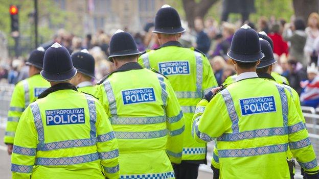 Police officers in high-visibility coats