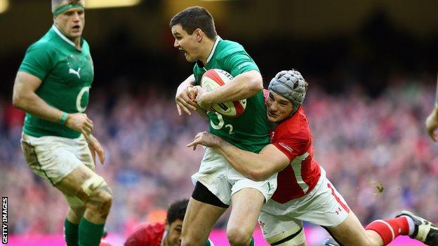 Jonathan Sexton is tackled by Jonathan Davies