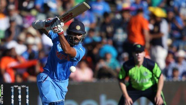 Shikhar Dhawan plays a shot during his innings of 100