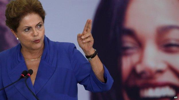 Brazil's President Dilma Rousseff speaks during a signing ceremony for a harsher law against femicide, at the Planalto Presidential Palace in Brasilia, Brazil, Monday, March 9, 2015.