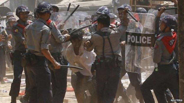 Police hit a student protester during violence in Letpadan 10 March 2015.