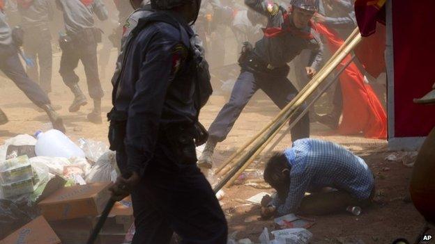 Police officers button charge a student protester during a crackdown in Letpadan, 140 kilometres (90 miles) north of the country's main city Yangon, Myanmar, Tuesday 10 March2015