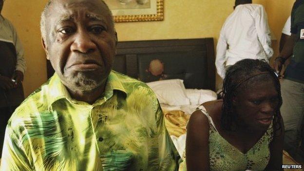 Ivory Coast's Laurent Gbagbo (L) and his wife Simone sit in a room at Hotel Golf in Abidjan, after they were arrested on 11 April 2011