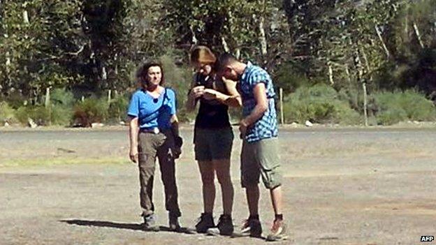 The three French sports stars (from L) Champion sailor Florence Arthaud, Olympic gold medallist swimmer Camille Muffat, and Olympic boxer Alexis Vastine, moments before they getting aboard a helicopter that crashed while filming a reality TV show on Monday in La Rioja, Argentina